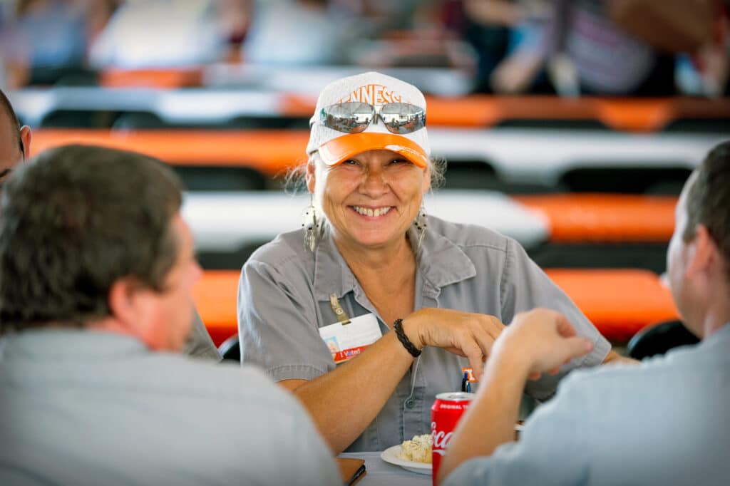 image of Facilities Services employee wearing a UT ball cap and smiling into the camera during the annual staff appreciation picnic - Organizational Charts