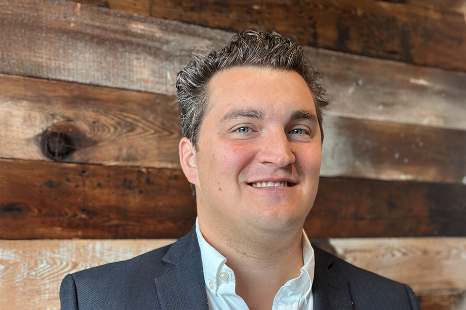 image of Josh Spenard, Construction Project Manager, wearing white shirt and grey suite jacket - Construction team