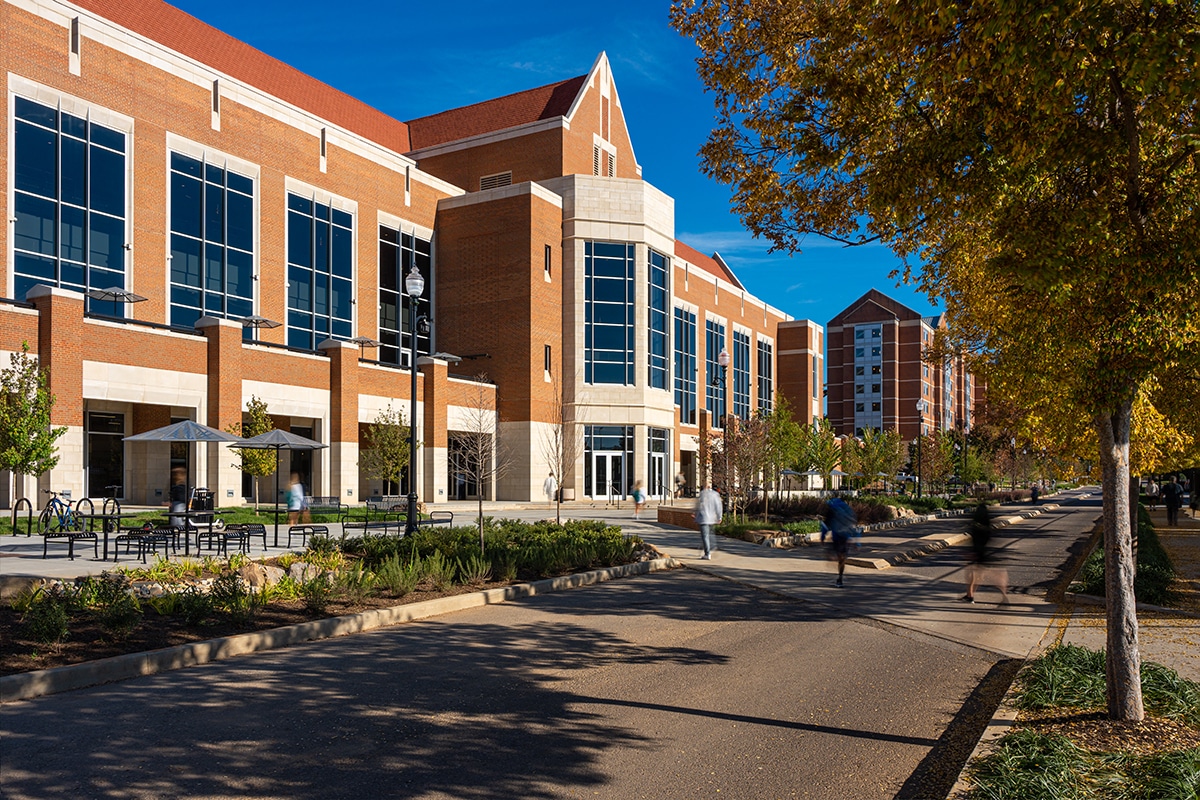exterior image of Rocky Top Dining Facility with picnic tables and stormwater features out front