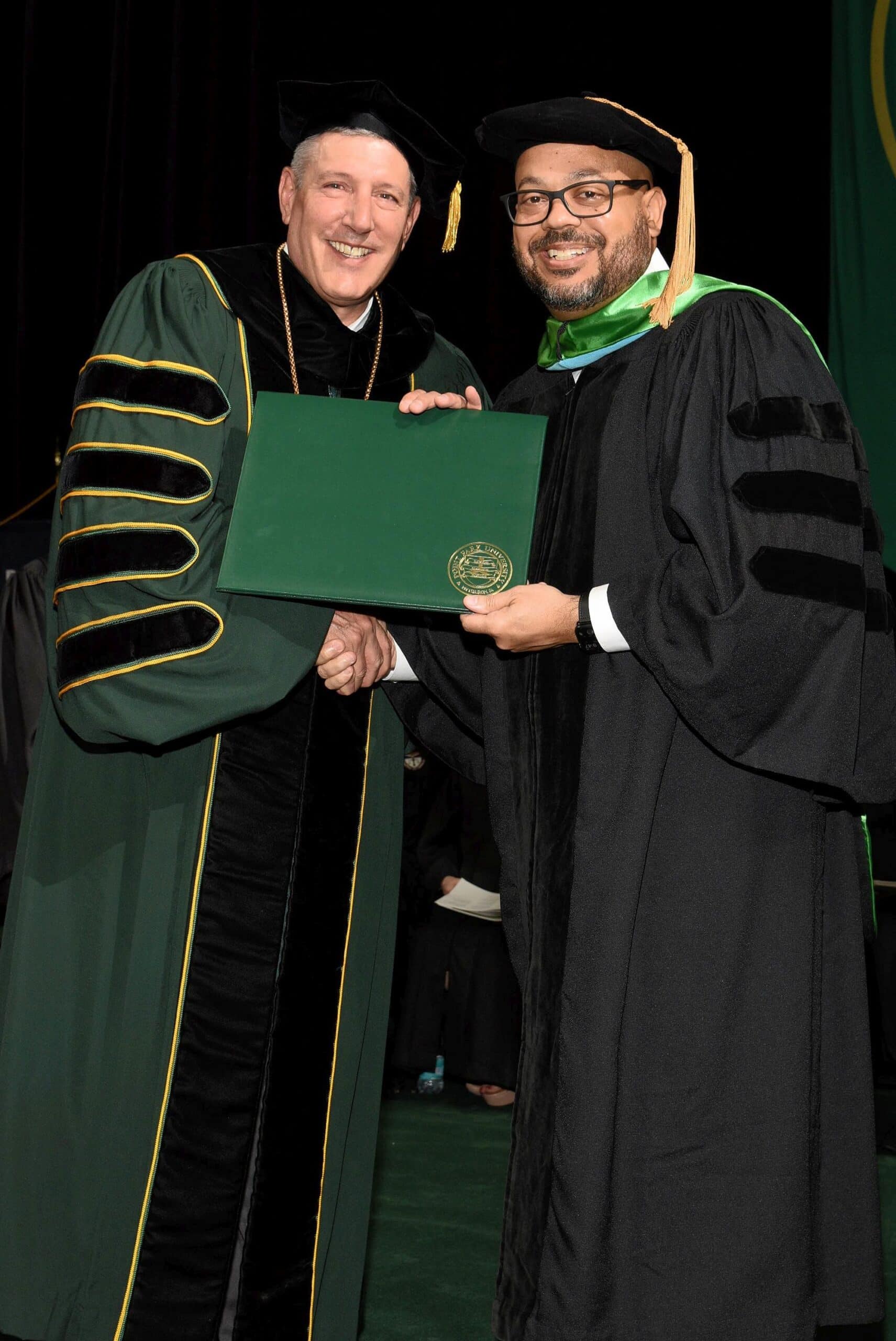 Michael Howze receives diploma for EdD degree at Point Park University