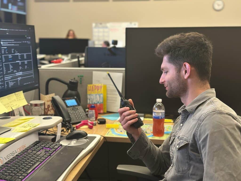 Work Order Management team member Sam Shiflett radios in a call to maintenance