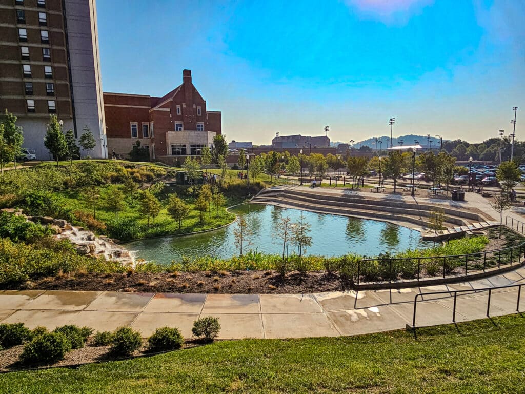photo of the regional stormwater park on the west end of UT's campus featuring a lovely water feature with other campus buildings in the background