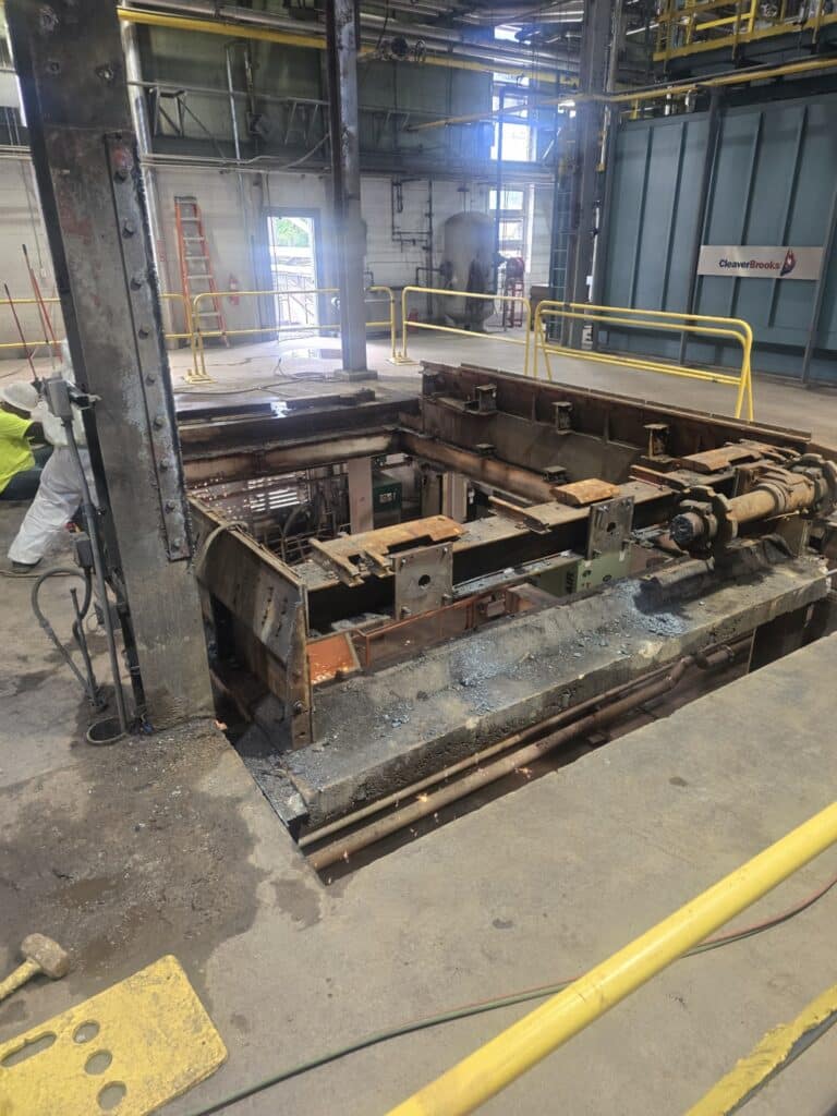 Image shows the Steam Plant at present with boiler #1 removed. Steel infrastructure remains where the boiler once stood. The plant is now in a transition between the old boiler and installation of a new one. 